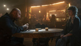 Boyce (Dave Bautista), Gray Alys (Milla Jovovich) in In the Lost Lands