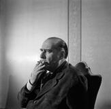 Portrait of Roberto Rossellini smoking a cigarette